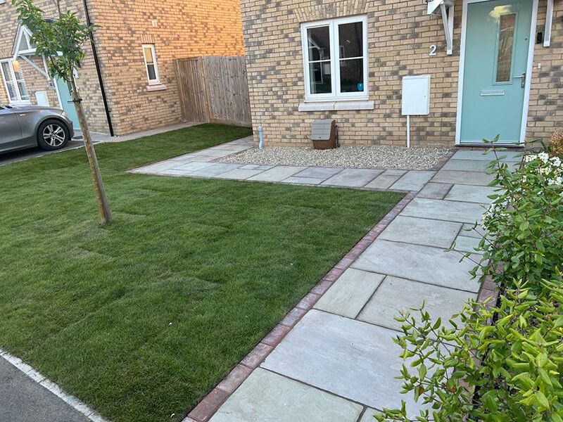 Indian Sandstone With Black Paving Edges and New Turf - Canterbury, Kent