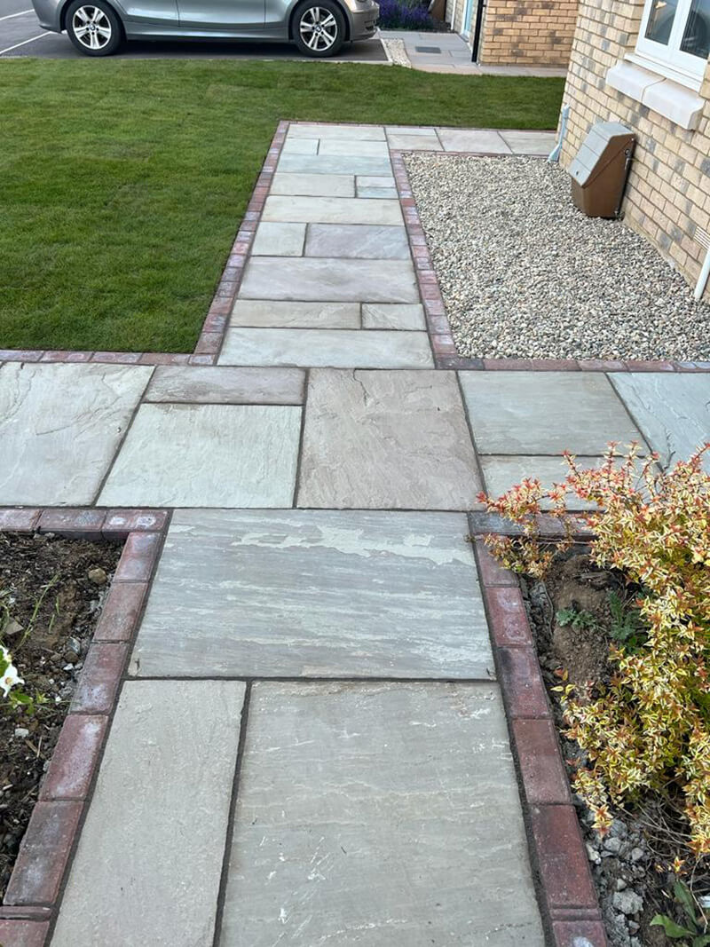 Indian Sandstone With Black Paving Edges and New Turf - Canterbury, Kent
