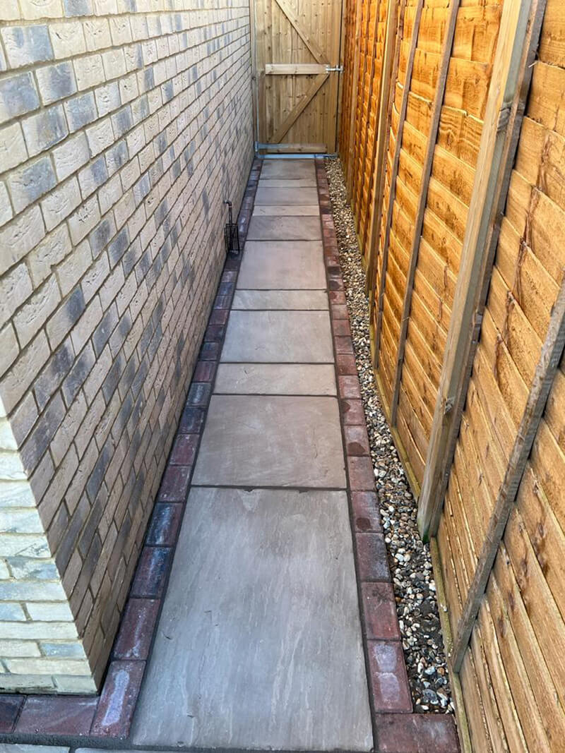 Indian Sandstone With Black Paving Edges and New Turf - Canterbury, Kent