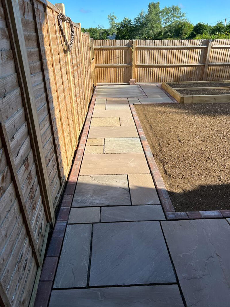 Indian Sandstone With Black Paving Edges and New Turf - Canterbury, Kent